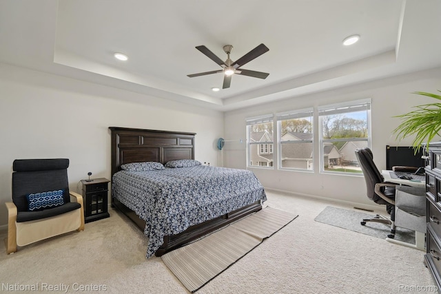 222 Quartz Way, White Lake, MI 48386 - bedroom featuring a tray ceiling, light carpet, a desk, recessed lighting, and ceiling fan