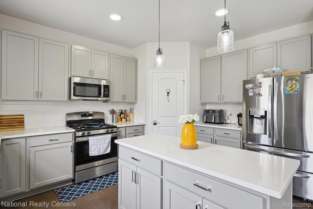 222 Quartz Way, White Lake, MI 48386 - kitchen with appliances with stainless steel finishes, gray cabinetry, light countertops, decorative backsplash, and recessed lighting