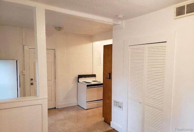 163 Seward St, Pontiac, MI 48342 - hall featuring light tile patterned floors and a textured ceiling