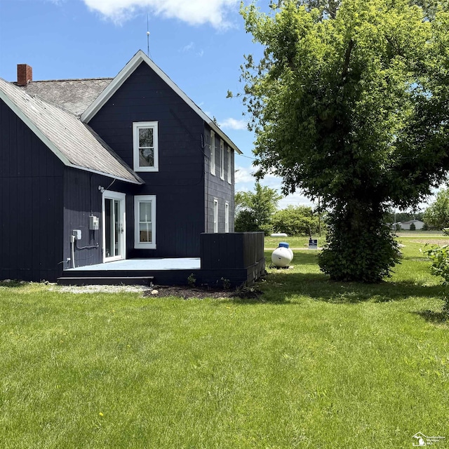 18200 Sherman, Milan, MI 48160 - rear view of house featuring a yard and a chimney