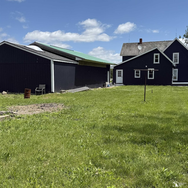 18200 Sherman, Milan, MI 48160 - view of green lawn featuring an outbuilding and an outdoor structure