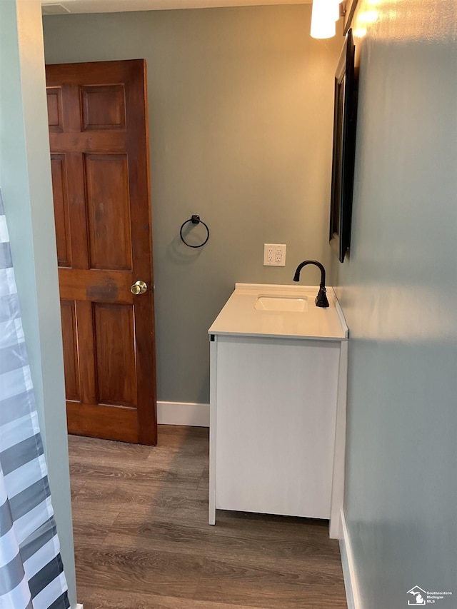 18200 Sherman, Milan, MI 48160 - bathroom with wood finished floors, vanity, and baseboards