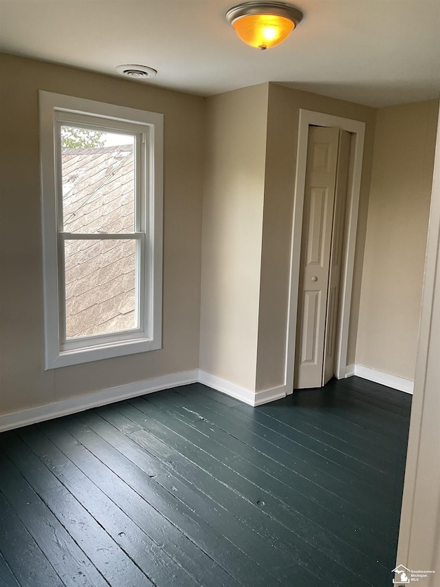 18200 Sherman, Milan, MI 48160 - empty room featuring baseboards and dark wood-type flooring