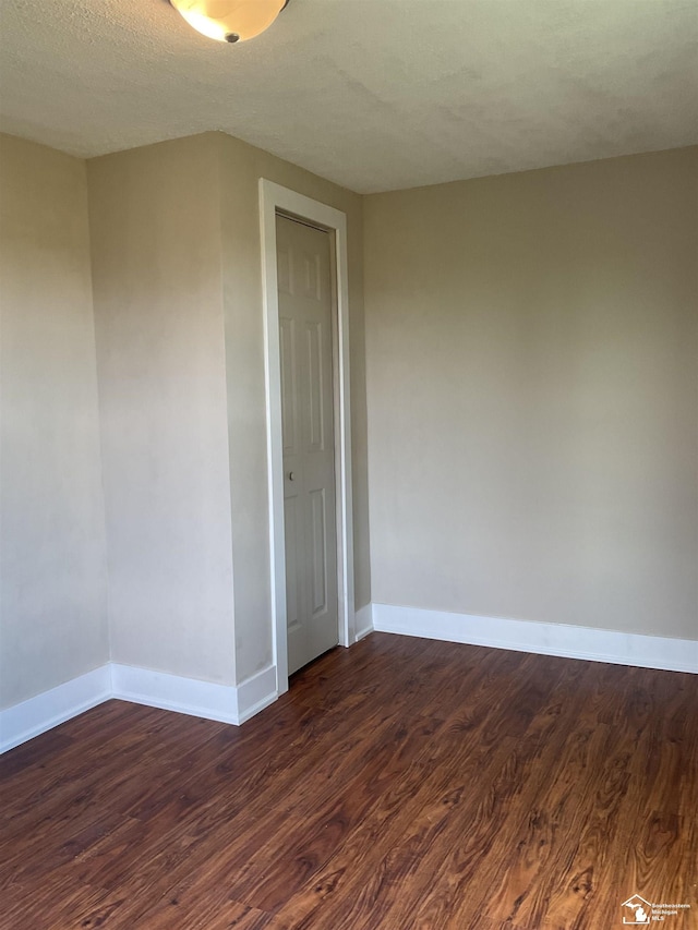 18200 Sherman, Milan, MI 48160 - unfurnished room with dark wood finished floors and baseboards