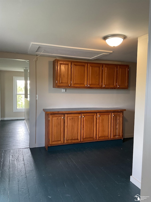 18200 Sherman, Milan, MI 48160 - kitchen featuring brown cabinets, dark wood finished floors, and baseboards