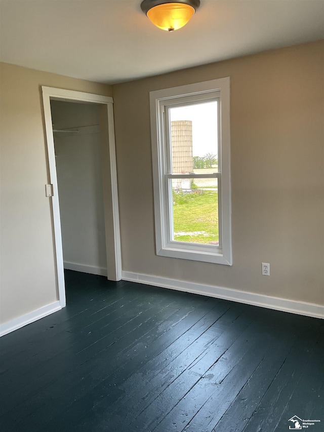 18200 Sherman, Milan, MI 48160 - spare room featuring dark wood-style floors and baseboards