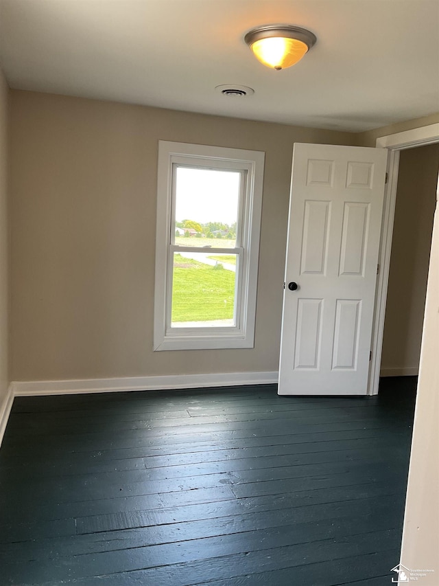 18200 Sherman, Milan, MI 48160 - spare room featuring baseboards and hardwood / wood-style floors