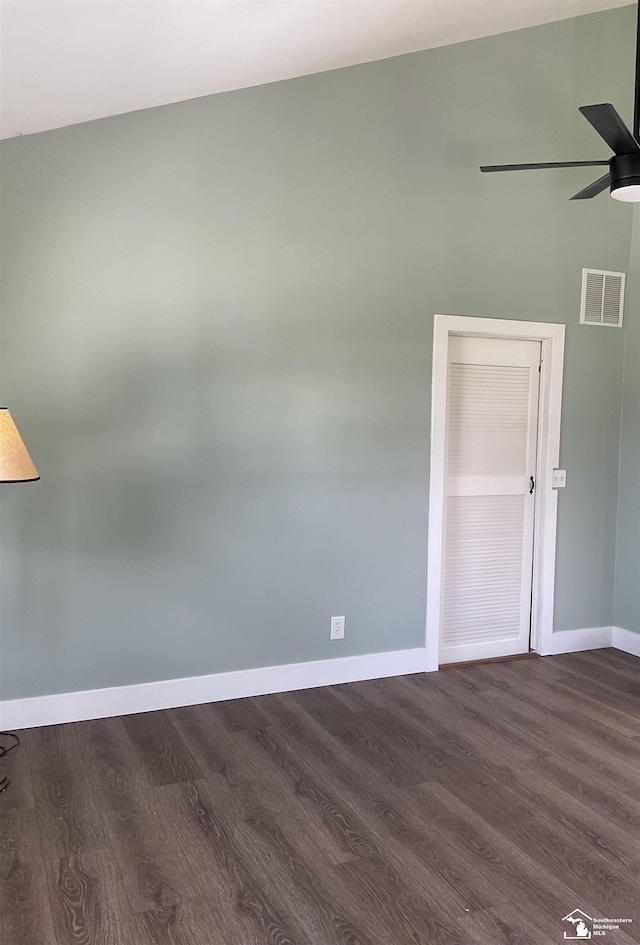 18200 Sherman, Milan, MI 48160 - spare room featuring baseboards, dark wood-type flooring, and a ceiling fan