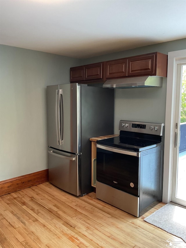 18200 Sherman, Milan, MI 48160 - kitchen with stainless steel appliances, extractor fan, light wood finished floors, and baseboards