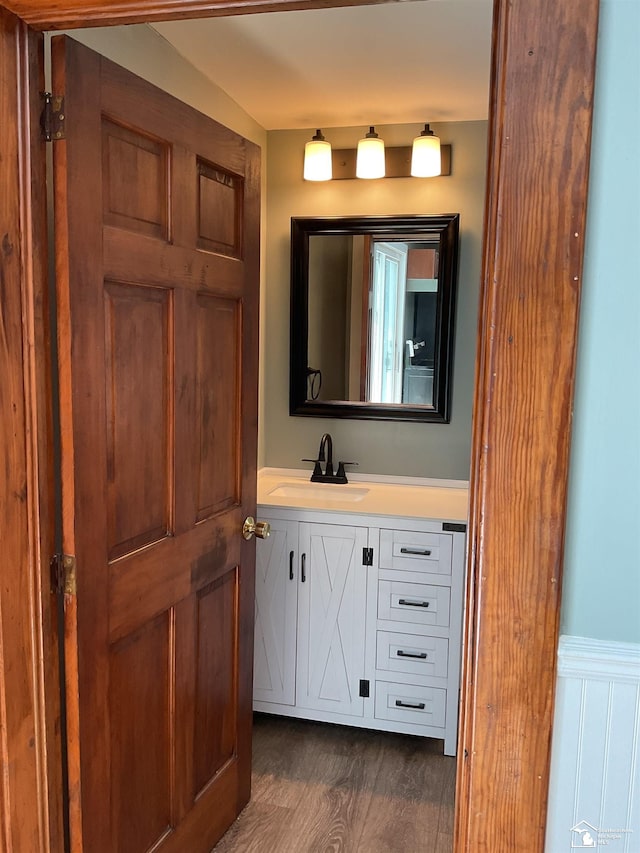 18200 Sherman, Milan, MI 48160 - bathroom with vanity, wood finished floors, and wainscoting
