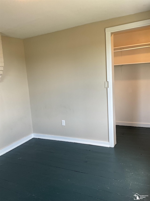 18200 Sherman, Milan, MI 48160 - unfurnished bedroom with baseboards, a spacious closet, and a closet