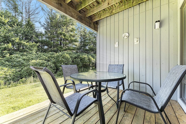 5737 Hilltop Way, Williamsburg, MI 49690 - wooden terrace featuring outdoor dining space and a yard