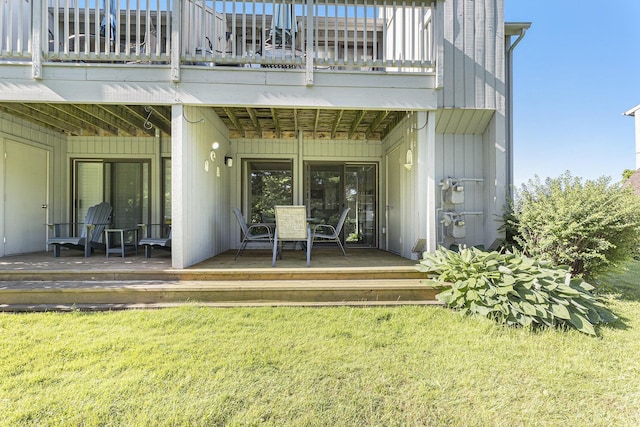 5737 Hilltop Way, Williamsburg, MI 49690 - rear view of house with a yard, a balcony, and a deck