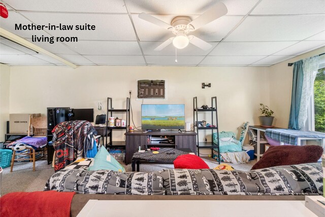 111 Greenleaf St, Onsted, MI 49265 - living room featuring a paneled ceiling, carpet floors, and a ceiling fan