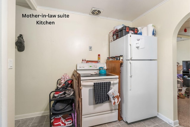 111 Greenleaf St, Onsted, MI 49265 - kitchen with white appliances, arched walkways, ornamental molding, baseboards, and tile patterned floors
