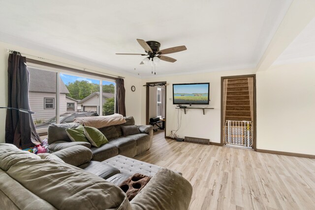 111 Greenleaf St, Onsted, MI 49265 - living room with baseboards, light wood-type flooring, and a ceiling fan