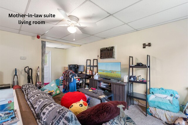111 Greenleaf St, Onsted, MI 49265 - carpeted living area featuring a drop ceiling and ceiling fan