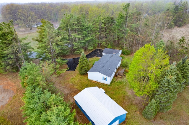8279 Luce St, Alanson, MI 49706 - aerial view of property and surrounding area featuring a heavily wooded area