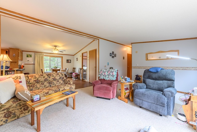 8279 Luce St, Alanson, MI 49706 - carpeted living area with ornamental molding, ceiling fan, and lofted ceiling