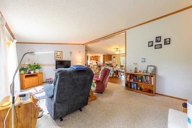 8279 Luce St, Alanson, MI 49706 - carpeted living room with ornamental molding, a textured ceiling, and a ceiling fan