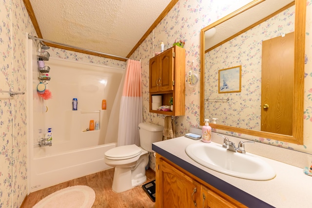 8279 Luce St, Alanson, MI 49706 - full bath featuring wallpapered walls, a textured ceiling, toilet, shower / bath combo, and vanity