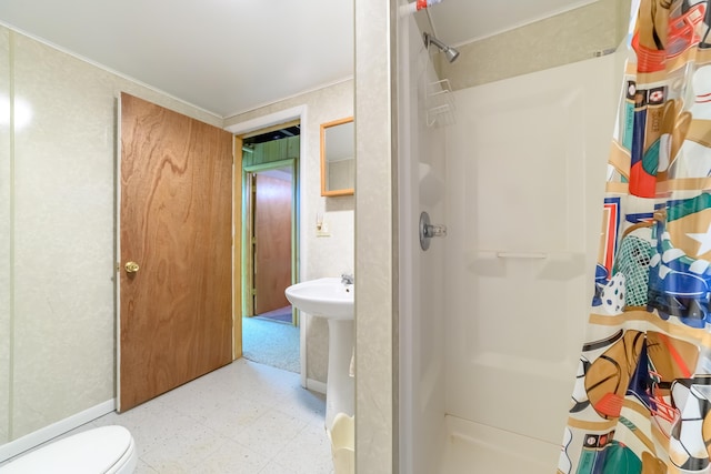8279 Luce St, Alanson, MI 49706 - bathroom featuring tile patterned floors, a stall shower, toilet, and crown molding