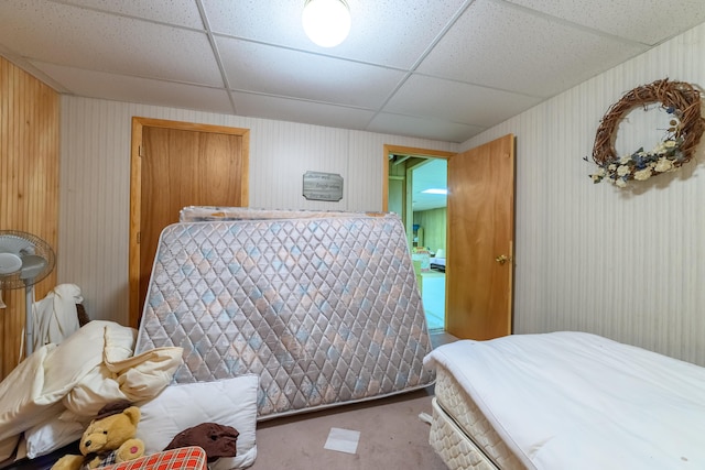 8279 Luce St, Alanson, MI 49706 - bedroom featuring light carpet and a drop ceiling