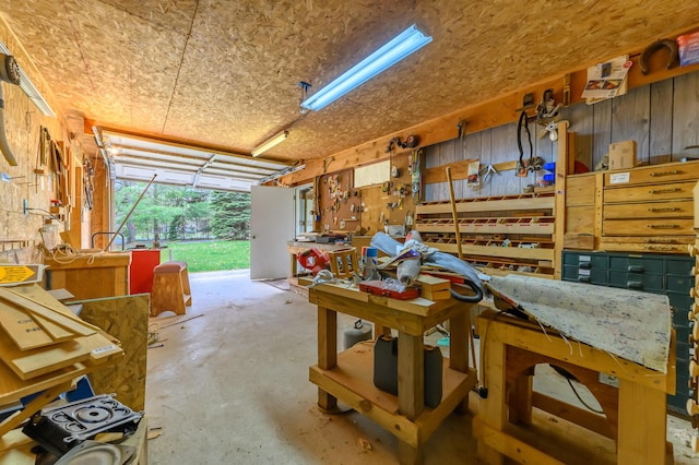 8279 Luce St, Alanson, MI 49706 - garage with a workshop area