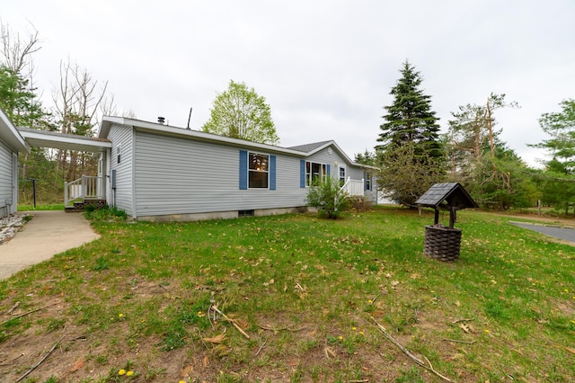 8279 Luce St, Alanson, MI 49706 - view of property exterior with a lawn