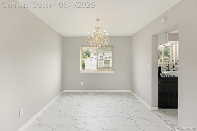 4325 Fox Hill Dr, Sterling Heights, MI 48310 - empty room with light marble finish flooring, a chandelier, baseboards, and healthy amount of natural light