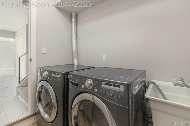 4325 Fox Hill Dr, Sterling Heights, MI 48310 - laundry room with marble look tiles and washing machine and dryer