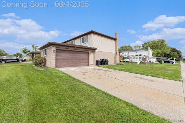 4325 Fox Hill Dr, Sterling Heights, MI 48310 - view of property exterior featuring a chimney, a yard, driveway, a garage, and brick siding
