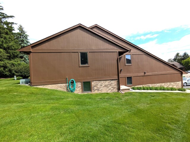 599 Echo Ct, Saline, MI 48176 - view of property exterior with a lawn and cooling unit