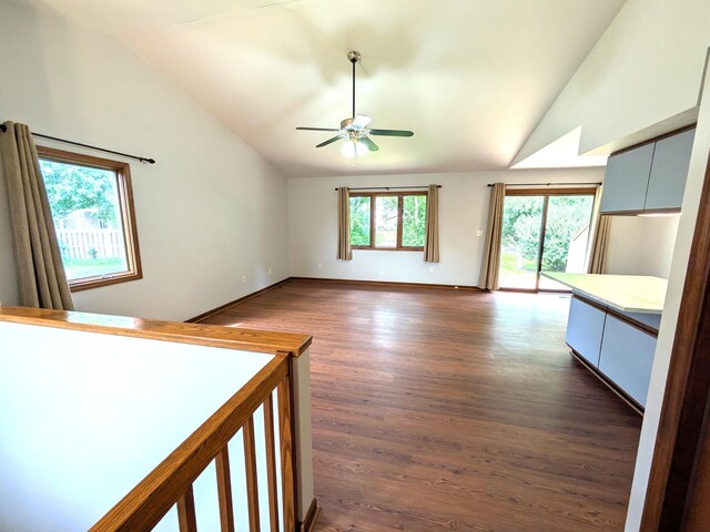 599 Echo Ct, Saline, MI 48176 - unfurnished bedroom with lofted ceiling, access to exterior, dark wood finished floors, baseboards, and ceiling fan