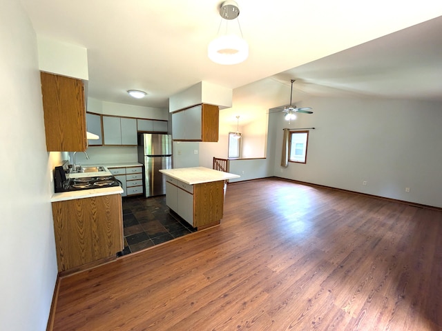 599 Echo Ct, Saline, MI 48176 - kitchen featuring freestanding refrigerator, light countertops, a sink, a ceiling fan, and brown cabinetry