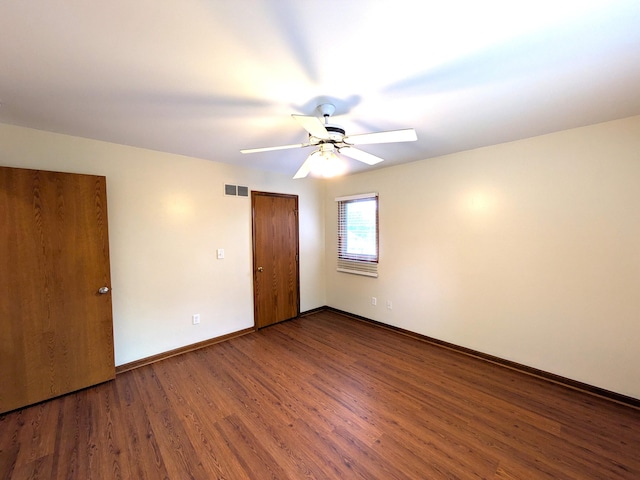 599 Echo Ct, Saline, MI 48176 - spare room featuring a ceiling fan, wood finished floors, and baseboards