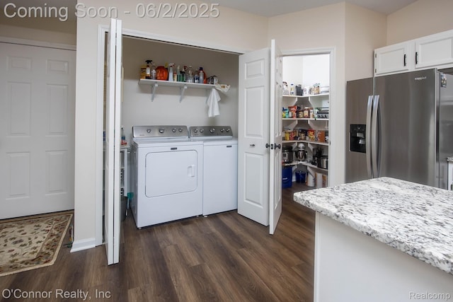 828 Crystal Ln, Marysville, MI 48040 - washroom featuring separate washer and dryer and dark wood-type flooring