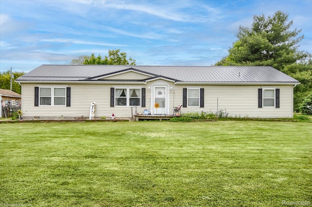 355 Carpenter Rd, Fostoria, MI 48435 - view of front of house with a front yard and metal roof