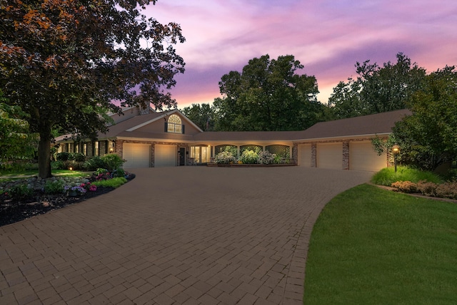 6130 Eidson Rd, Saint Joseph, MI 49085 - view of front of property featuring a garage and decorative driveway