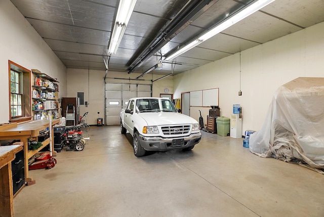 6130 Eidson Rd, Saint Joseph, MI 49085 - garage with a garage door opener and electric panel