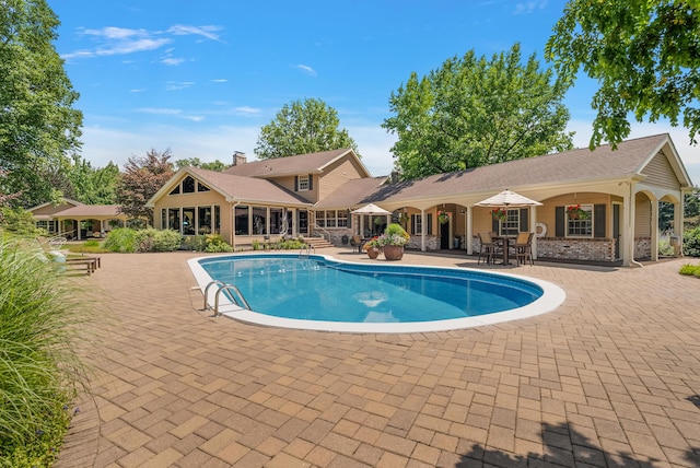 6130 Eidson Rd, Saint Joseph, MI 49085 - swimming pool featuring a patio area and outdoor dining area