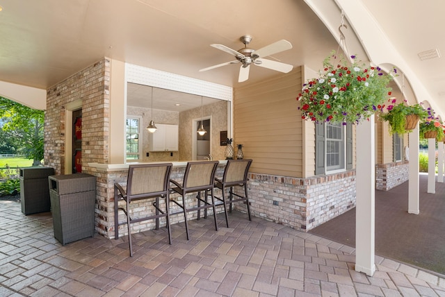 6130 Eidson Rd, Saint Joseph, MI 49085 - view of patio with exterior bar and ceiling fan