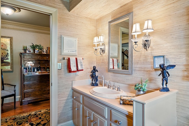 6130 Eidson Rd, Saint Joseph, MI 49085 - bathroom with vanity, wood finished floors, ornamental molding, and baseboards