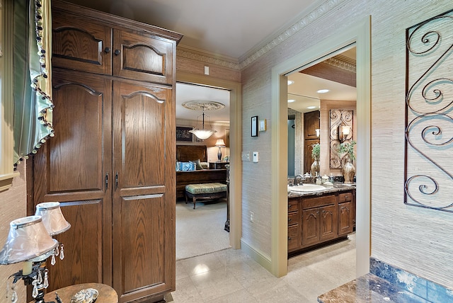 6130 Eidson Rd, Saint Joseph, MI 49085 - bathroom with vanity, ensuite bathroom, crown molding, baseboards, and wallpapered walls