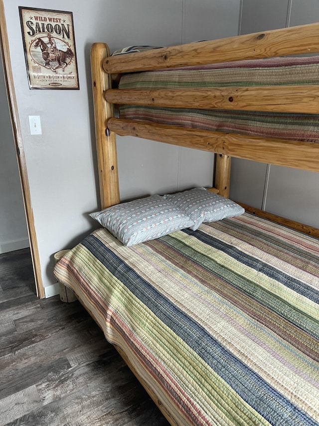 11064 S Hulbert Rd, Hulbert, MI 49748 - bedroom featuring dark wood finished floors and baseboards