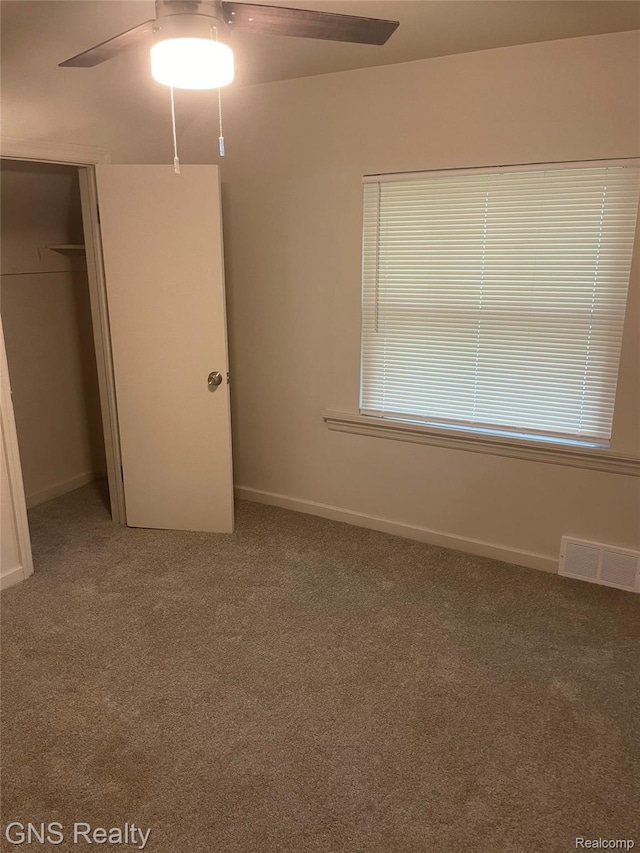 14275 Young St, Detroit, MI 48205 - unfurnished bedroom with carpet flooring, a closet, baseboards, and a ceiling fan