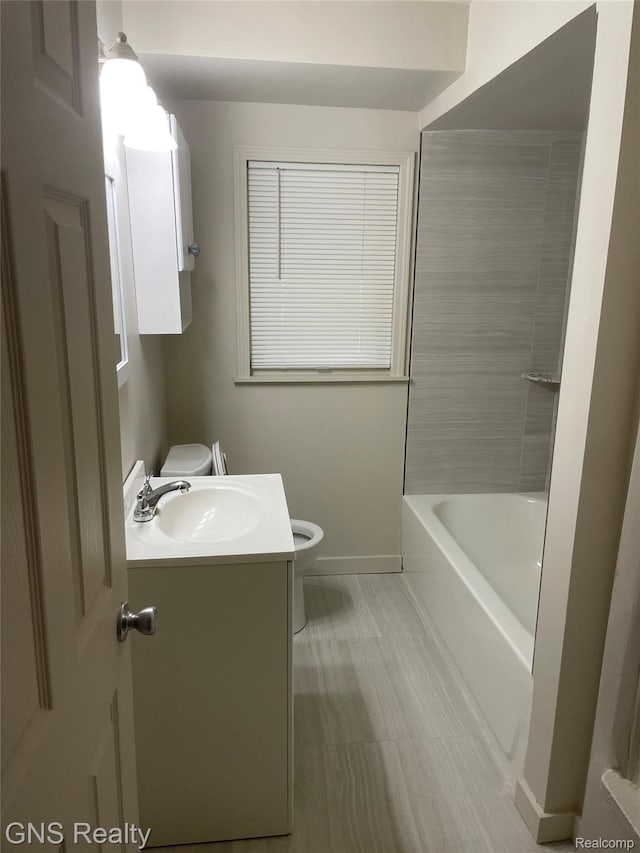 14275 Young St, Detroit, MI 48205 - bathroom featuring toilet, vanity, and baseboards