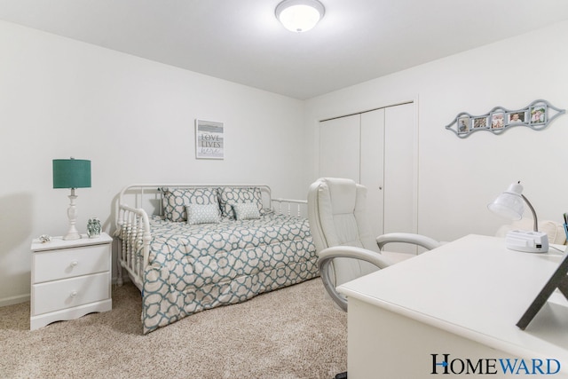 3361 English Hills Dr NW Unit 16, Grand Rapids, MI 49544 - bedroom featuring carpet flooring, a closet, and baseboards