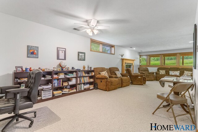 3361 English Hills Dr NW Unit 16, Grand Rapids, MI 49544 - carpeted home office with a tile fireplace and ceiling fan