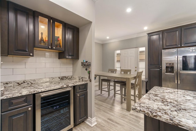 719 Webb St, Detroit, MI 48202 - kitchen featuring beverage cooler, stainless steel refrigerator with ice dispenser, ornamental molding, decorative backsplash, and dark brown cabinetry